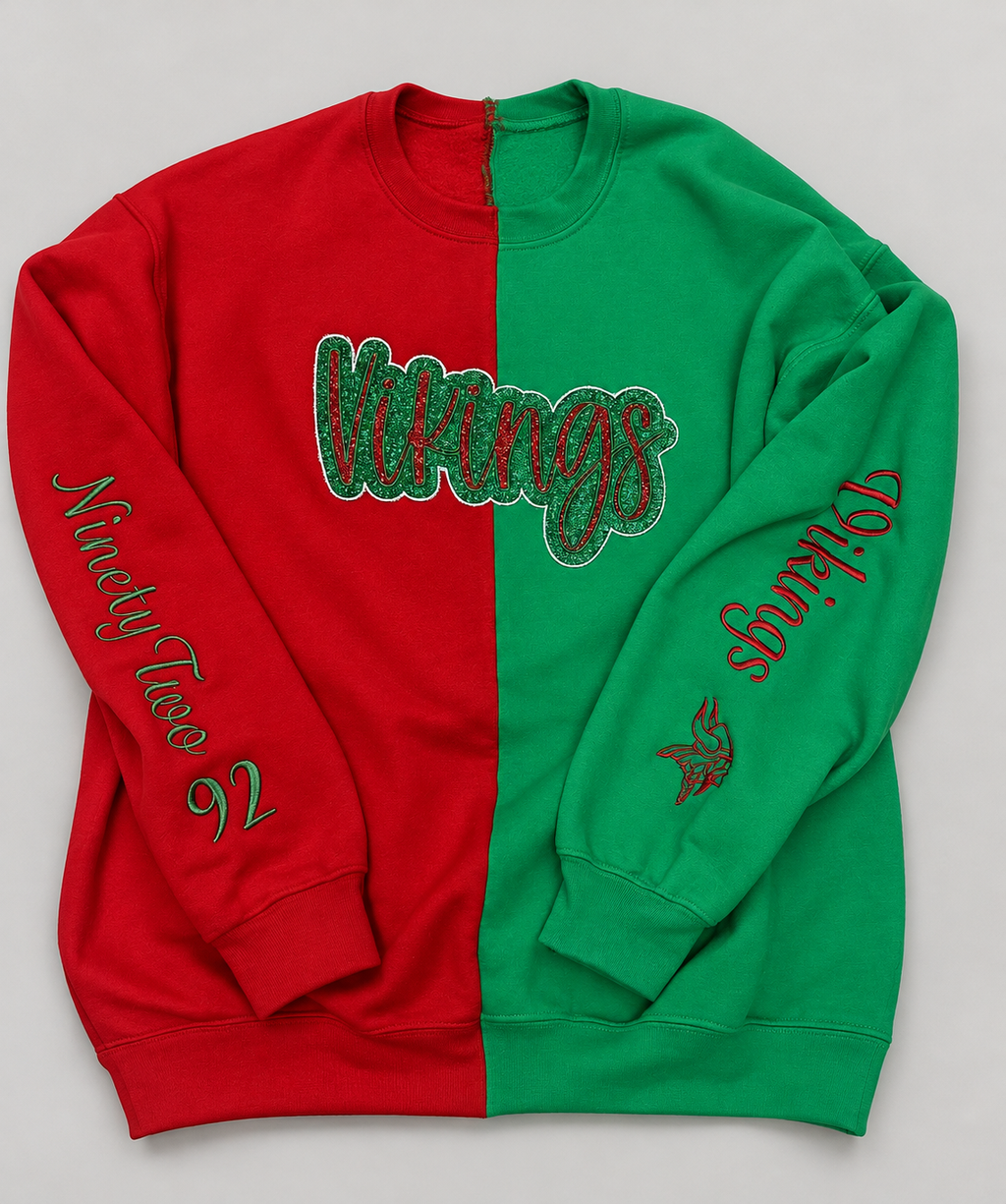 Personalized red and green split-color sweatshirt with double appliqué and sleeve embroidery, photographed on a neutral background